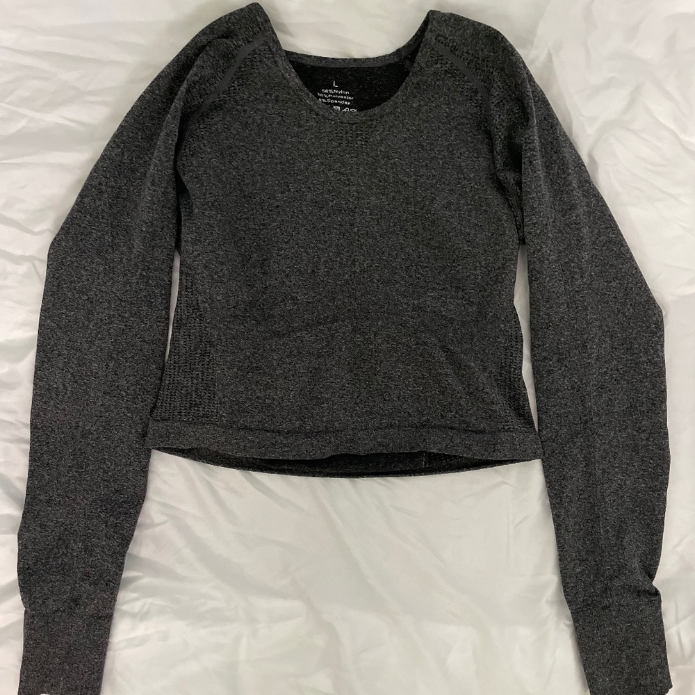 Grey fitted long sleeve workout top with thumb holes